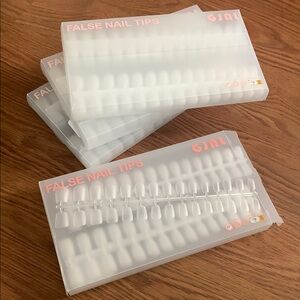 False Nail Tips Clear GJNL. New. 4 packages of 510 pieces. Short length.